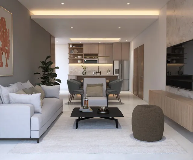 Open-concept living room and kitchen in a Vista Los Sueños condominium