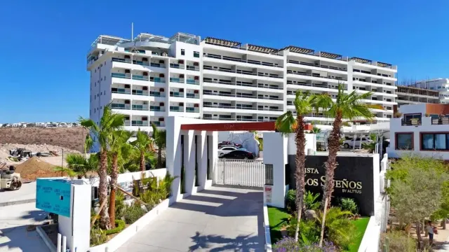 Entrance to Vista Los Sueños condominiums with lush greenery